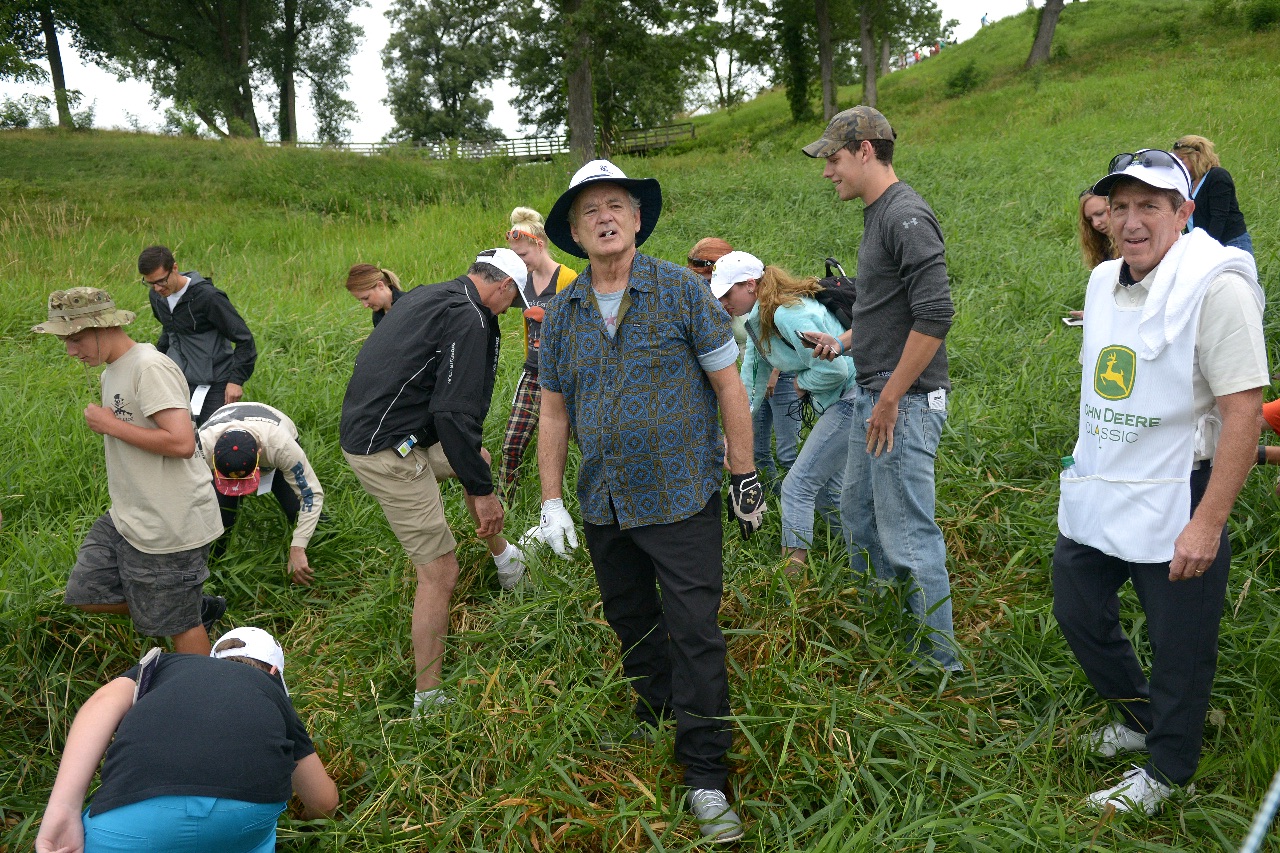 Actor Bill Murray, with the help of the gallery, searches for his ball in the deep rough along the 2nd fairway during the John Deere Classic Pro Am, Wednesday July 8, 2015, in Silvis. (Photo by Todd Mizener - Dispatch/Argus)