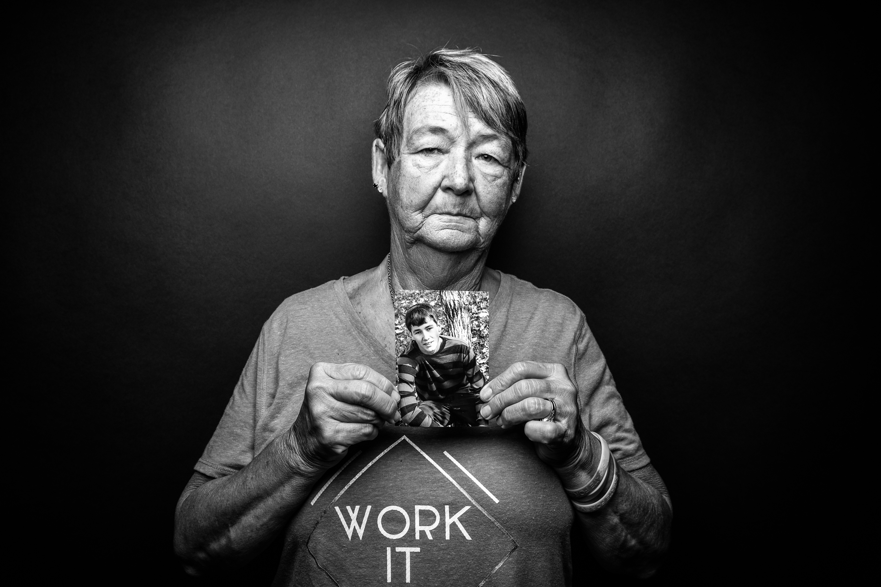 Karen Wernimont, Davenport, holds a photo of her grandson Zachary, who died by suicide at 22, in 2017.