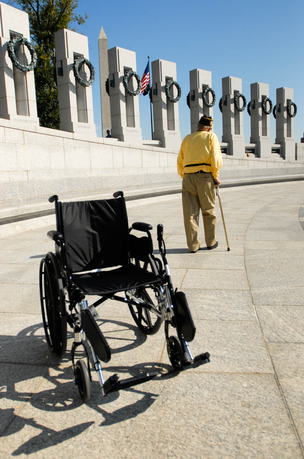 World War II veteran Joe Colmer, of East Moline, leaves his wheelchair behind as he takes a moment to himself while visiting the World War II Memorial in Washington D.C. on Nov. 1, 2008.  Colmer, a veteran of D-Day and other major battles during the war, was among 96 local veterans who traveled to the nation's capital to visit the World War II Memorial as part of Honor Flight of the Quad Cities. (Todd Mizener - Dispatch/Argus)