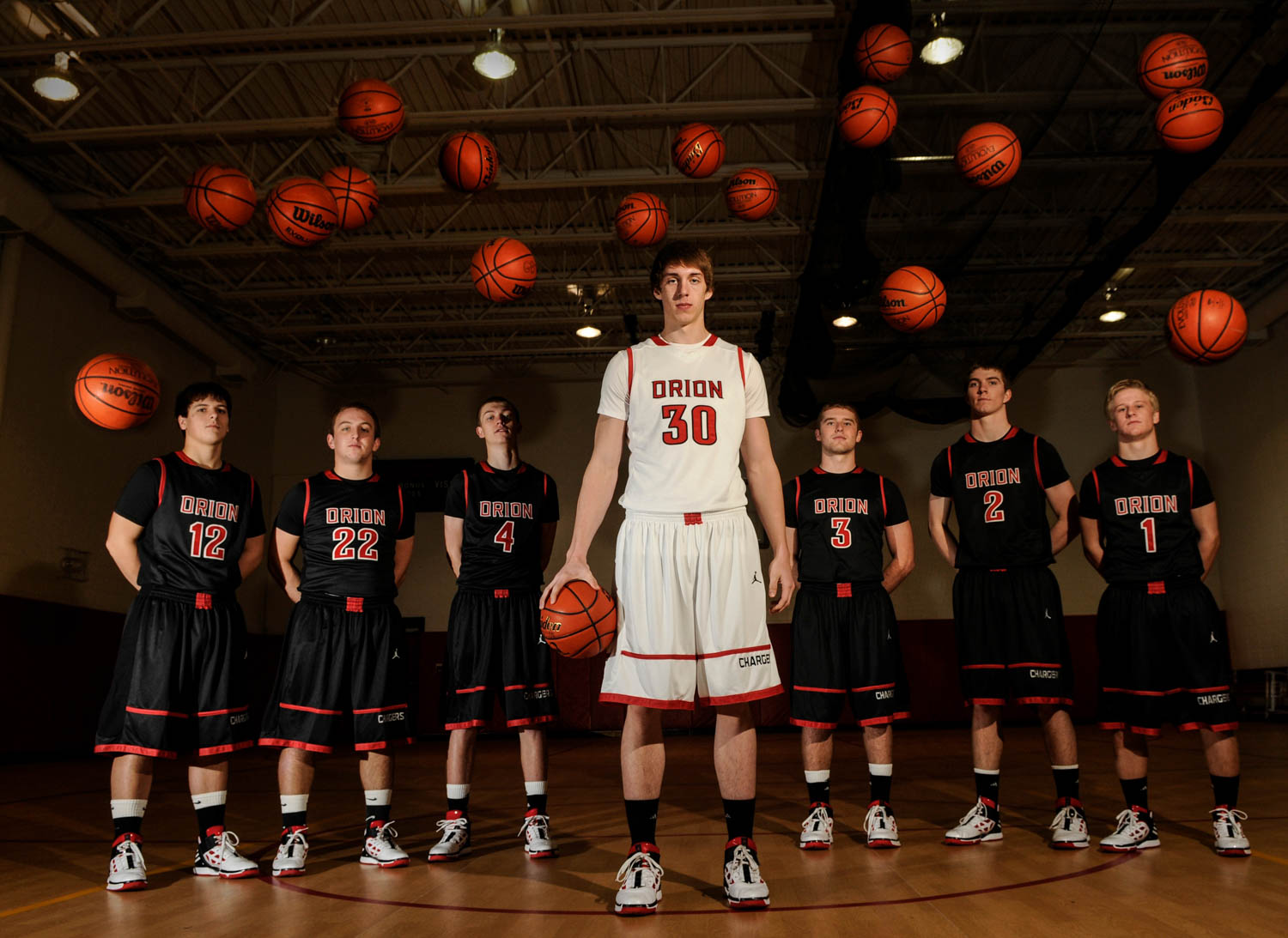 Tanner Williams, Orion High School senior forward, is off to another fast start with 82 points, 26 rebounds and three blocked shots as the Chargers went 4-0 and won their own Orion Tip-Off Classic, with Williams earning All-Tournament honors. Orion's seven seniors all have high hopes this year after going 30-4 and coming within a whisker of the Final Four. Pictured with Williams are Nick Lapaczonek, Zach Kahley, Brady Hancock, Royce Woodley, Trent DeDecker and Cory Stiles.  (Todd Mizener - Dispatch/Argus)