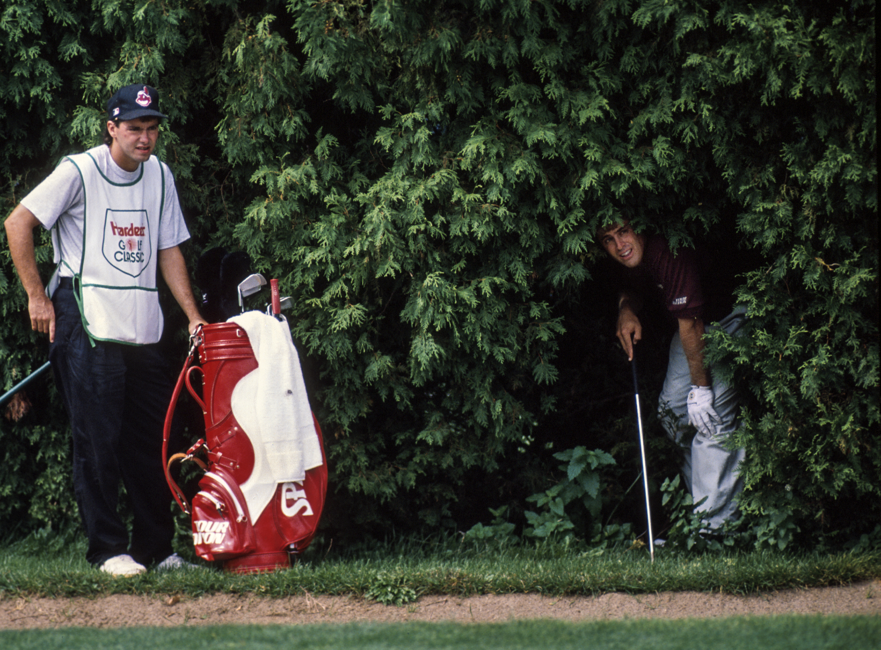 PGA golfer Steve Lamontagne looks for a way out of the trees behind the 8th green, during first round action of the Hardee's Golf Classic. (Todd Mizener - Dispatch/Argus)