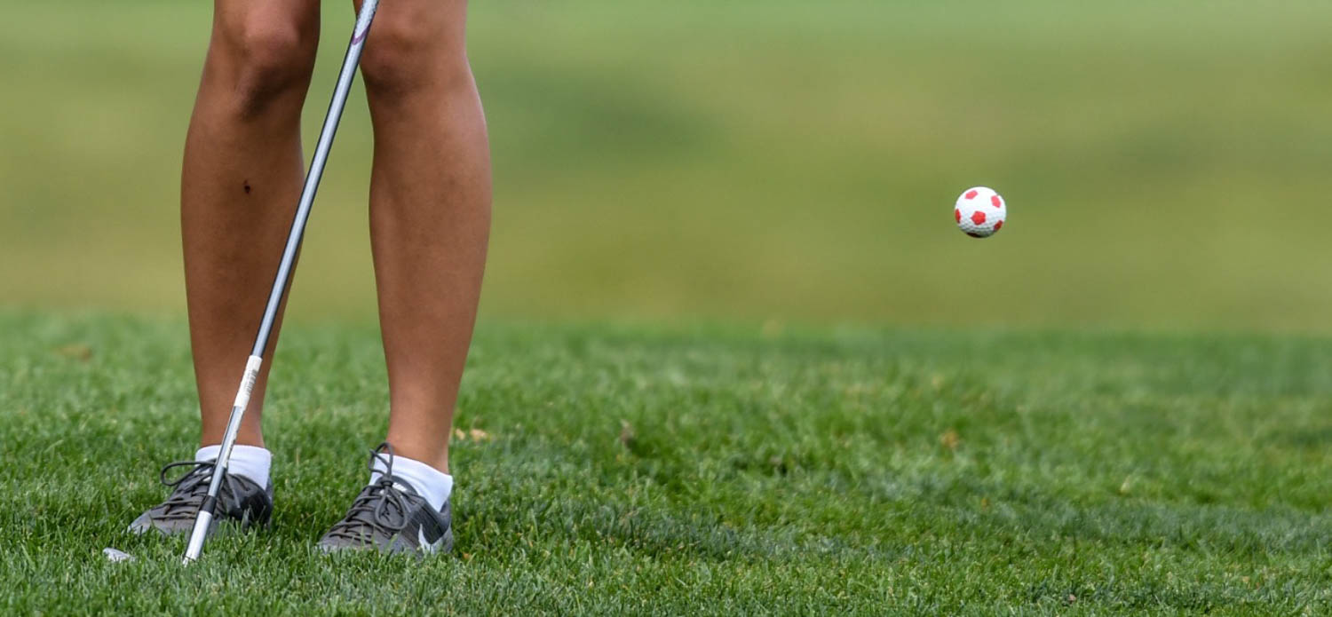 Moline’s Sam Cramer chips on to the 3rd green during the IHSA Class 2A girls golf regional Wednesday, Oct. 4, 2017, at Oakwood Country Club in Coal Valley. Cramer uses a soccer themed golf ball as an homage to her other favorite sport. (Todd Mizener - Dispatch/Argus)