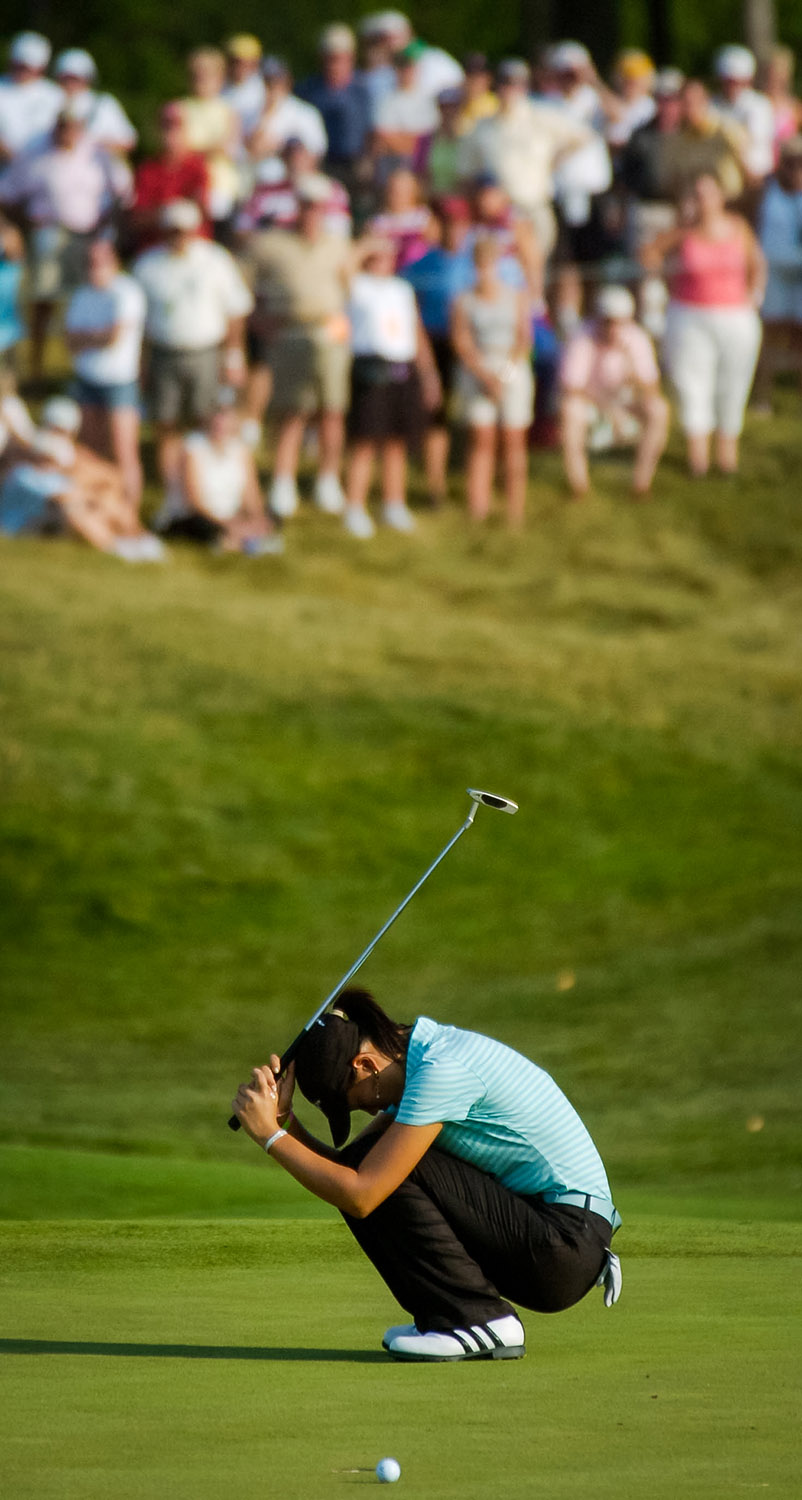 Michelle Wie reacts after narrowly missing a putt on the 8th green during the second round of the PGA's John Deere Classic. Wie needed to birdie the hole in order to keep her chances alive (with one hole to play) of being the first woman to make the cut in a PGA tour event since Babe Zaharias did it in 1945. (Todd Mizener - Dispatch/Argus)